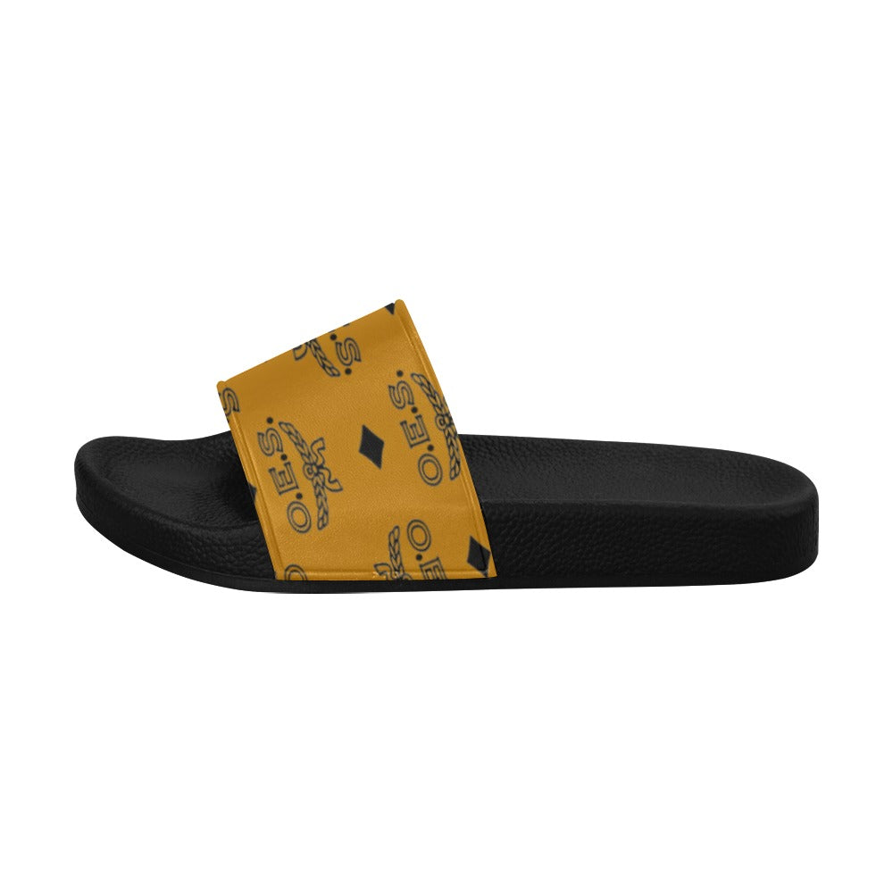 Black slide sandal with a yellow strap featuring a logo on a white background