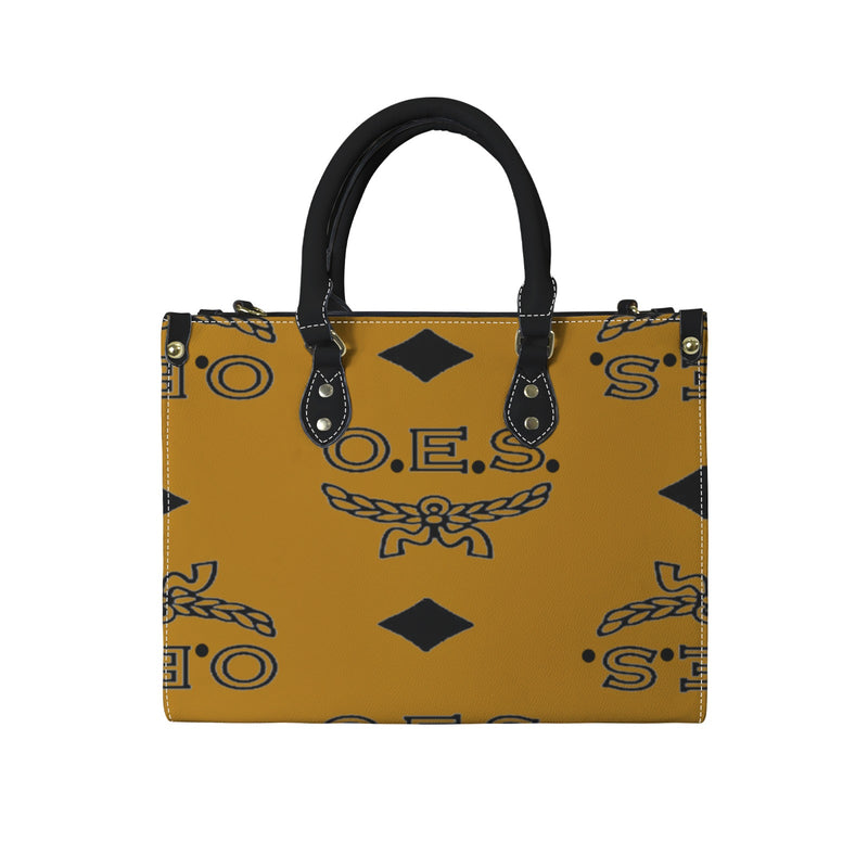 Cognac handbag with black pattern and handle on a white background