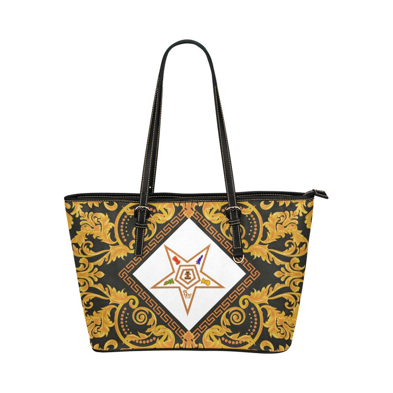 Tote bag with gold baroque pattern and central logo on a white background