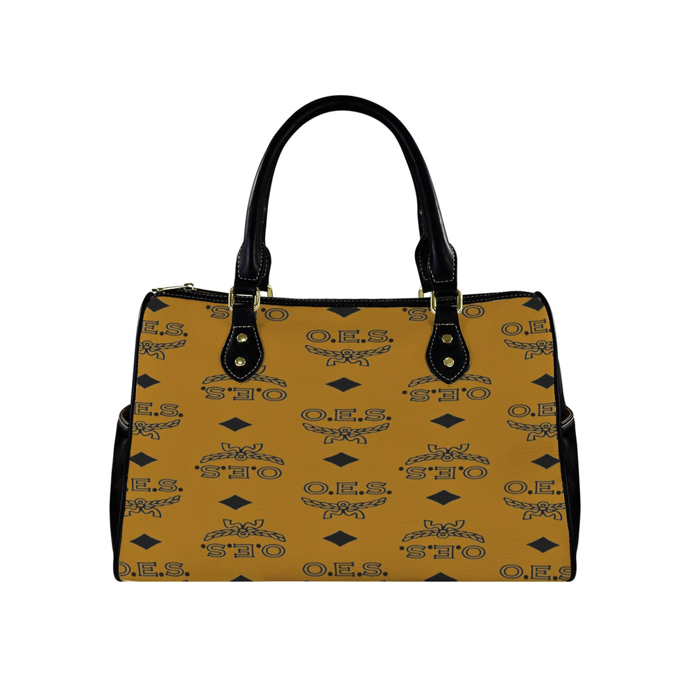 Cognac handbag with black handle and O.E.S. pattern on a white background