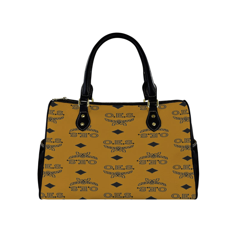 Cognac handbag with black handle and O.E.S. pattern on a white background