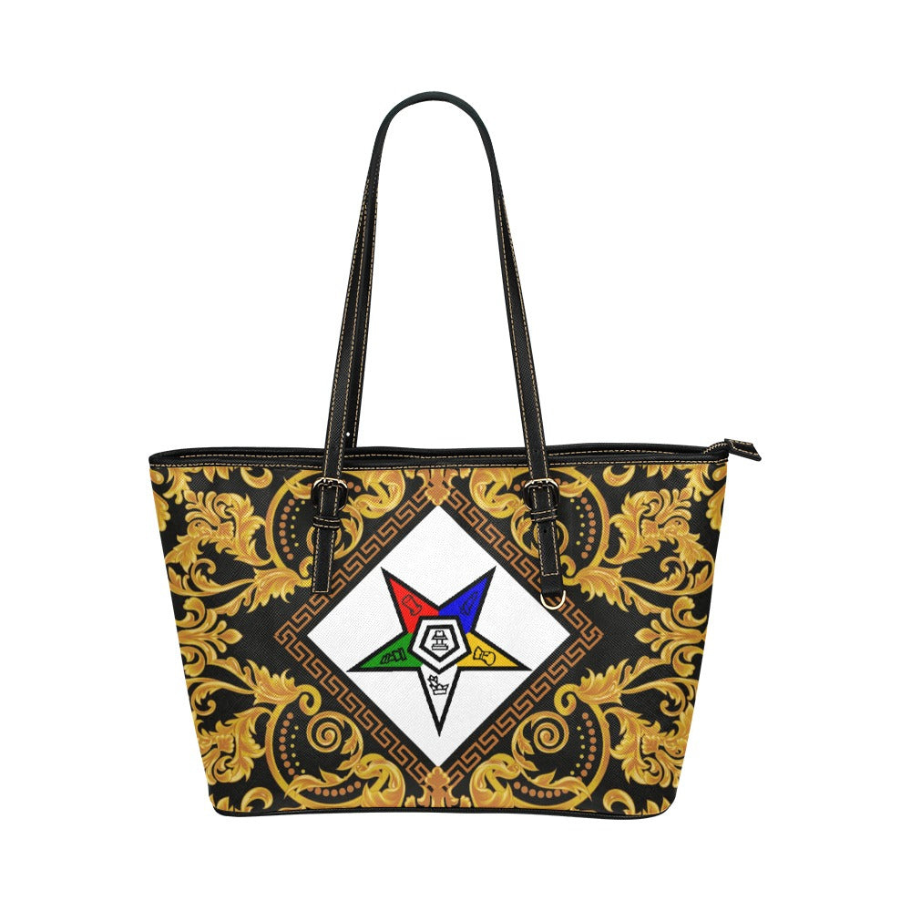 A tote bag featuring a Eastern Star with a l in the center, with gold and black colors.